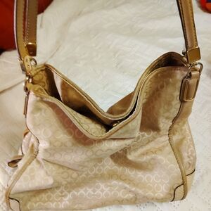 Medium Coach bag, tan in color